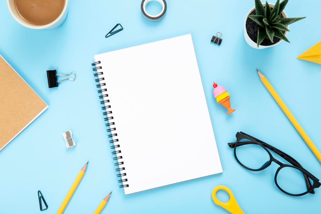 flat lay arrangement desk elements blue background